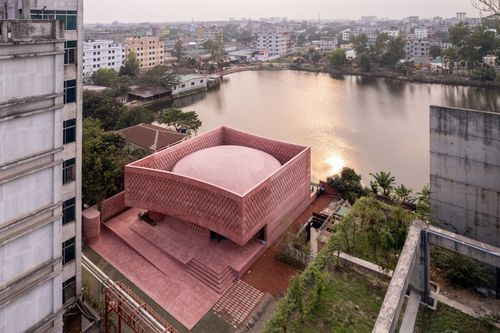 Studio Morphogenesis wraps waterside mosque in Bangladesh in per