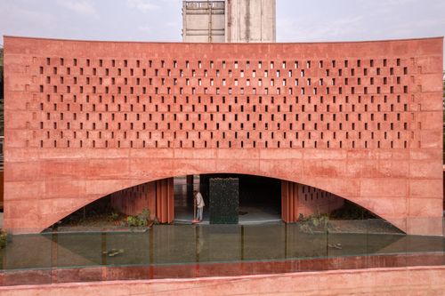 Studio Morphogenesis wraps waterside mosque in Bangladesh in per