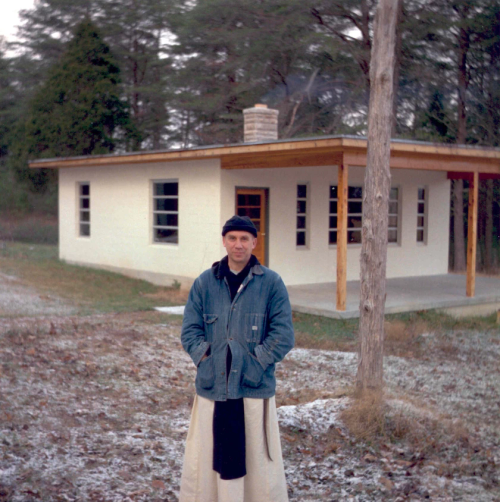 Thomas Merton in front of his hermitage at the Abbey of Our Lady